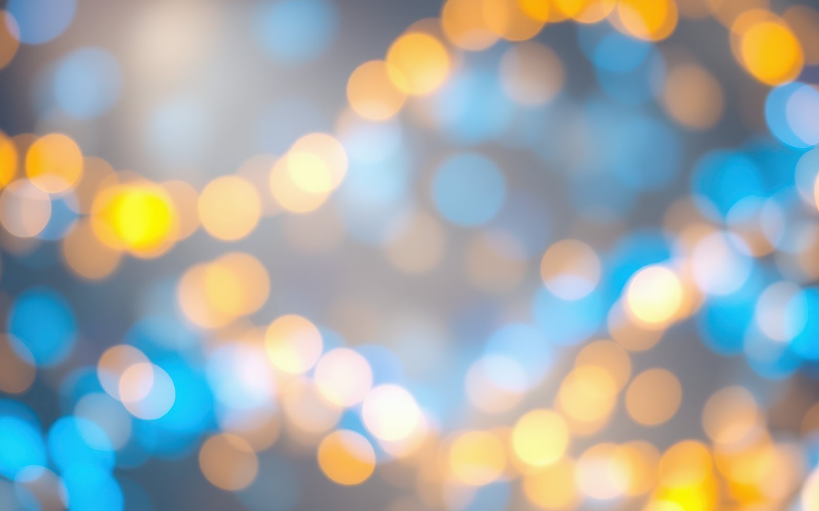 Colorful bokeh lights creating a festive atmosphere during an evening event in a vibrant setting